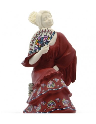 Flamenco dancer sitting with fan...